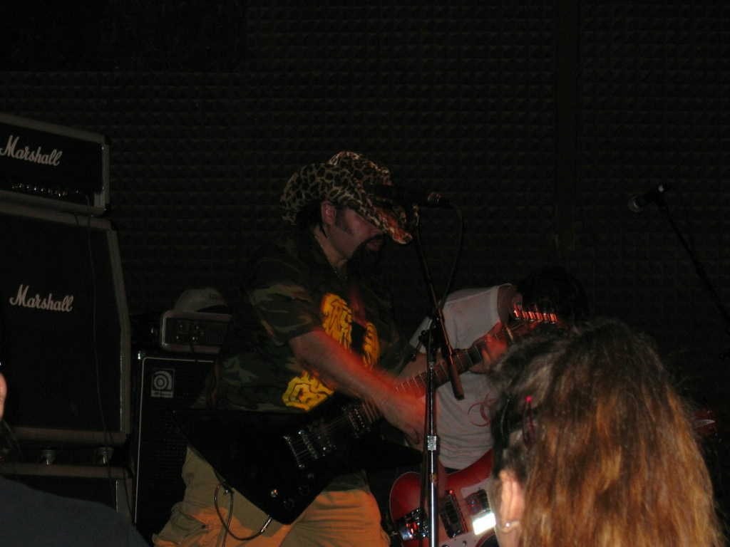 Luke Brewer playing lead guitar onstage